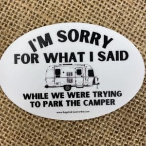 I'm Sorry for what I said text above an image of a airstream camper with while we were trying to park the camper text below on an oval sticker.