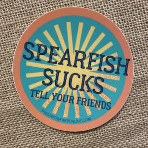 Spearfish Sucks Tells your Friends text above a yellow light symbol on teal background with an orange border.