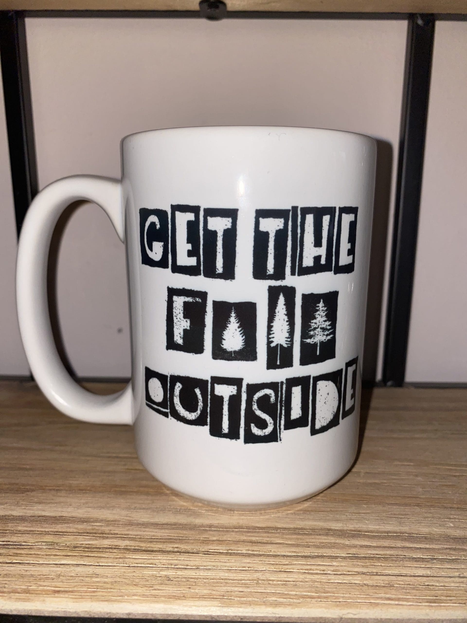 Custom mug with GET THE F OUTSIDE stylized text with trees censoring the F word