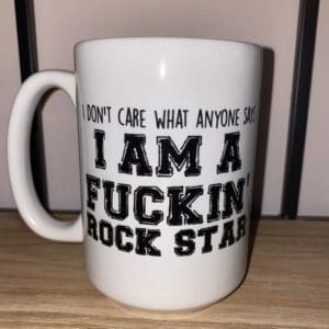 Custom mug with I don't care what anyone says I'm a fuckin' rock star text