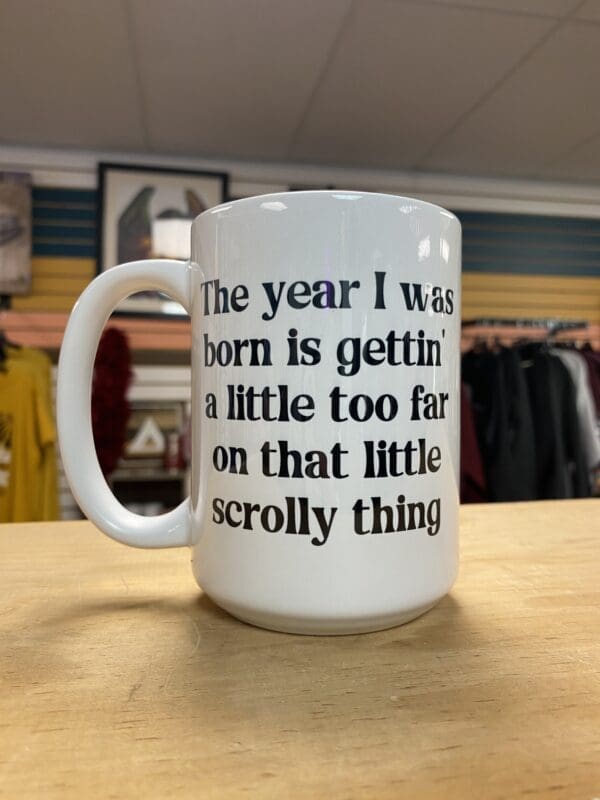 YEAR I WAS BORN IS A LITTLE TOO FAR CERAMIC MUG