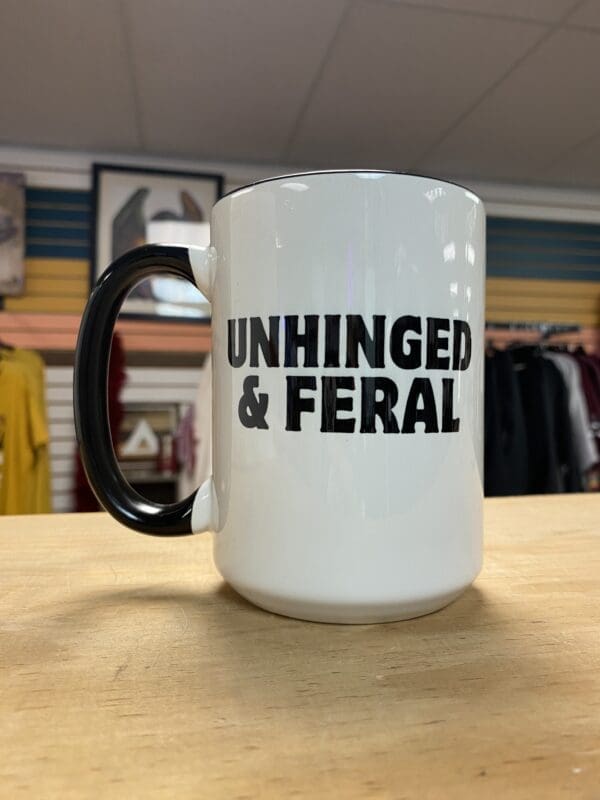 UNHINGED AND FERAL CERAMIC MUG